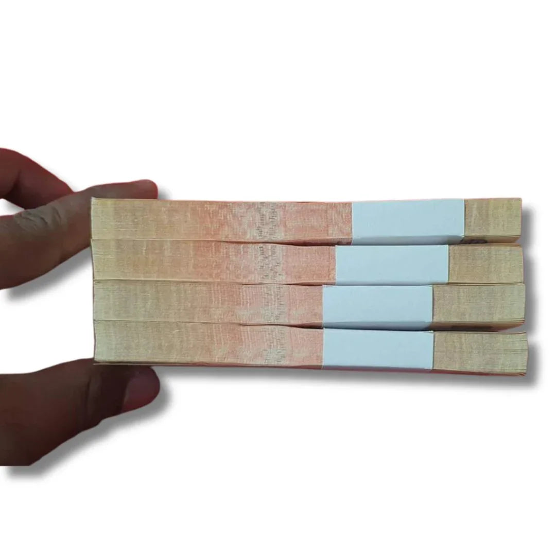 Side view of bundles of rare Indian Rs 10 currency notes held by a hand, collectible banknotes