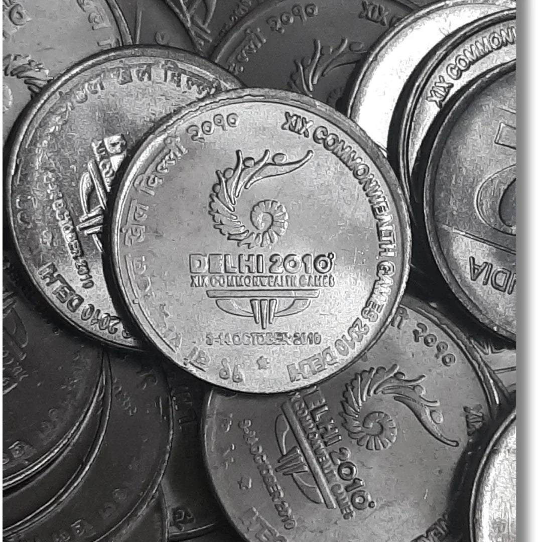 Rs 2 Delhi 2010 Commonwealth Games commemorative coin, collectible Indian coin pile