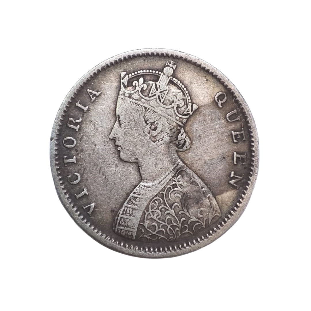 1862 India half rupee silver coin featuring Queen Victoria with floral wreath reverse, collectible British India coin.