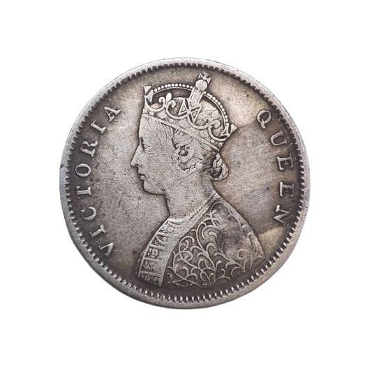 1862 India half rupee silver coin featuring Queen Victoria with floral wreath reverse, collectible British India coin.