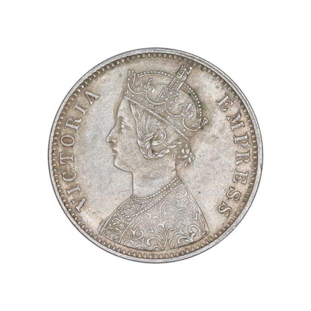 Rare 1900 one rupee India silver coin featuring Queen Victoria Empress with floral wreath reverse in collectible condition.