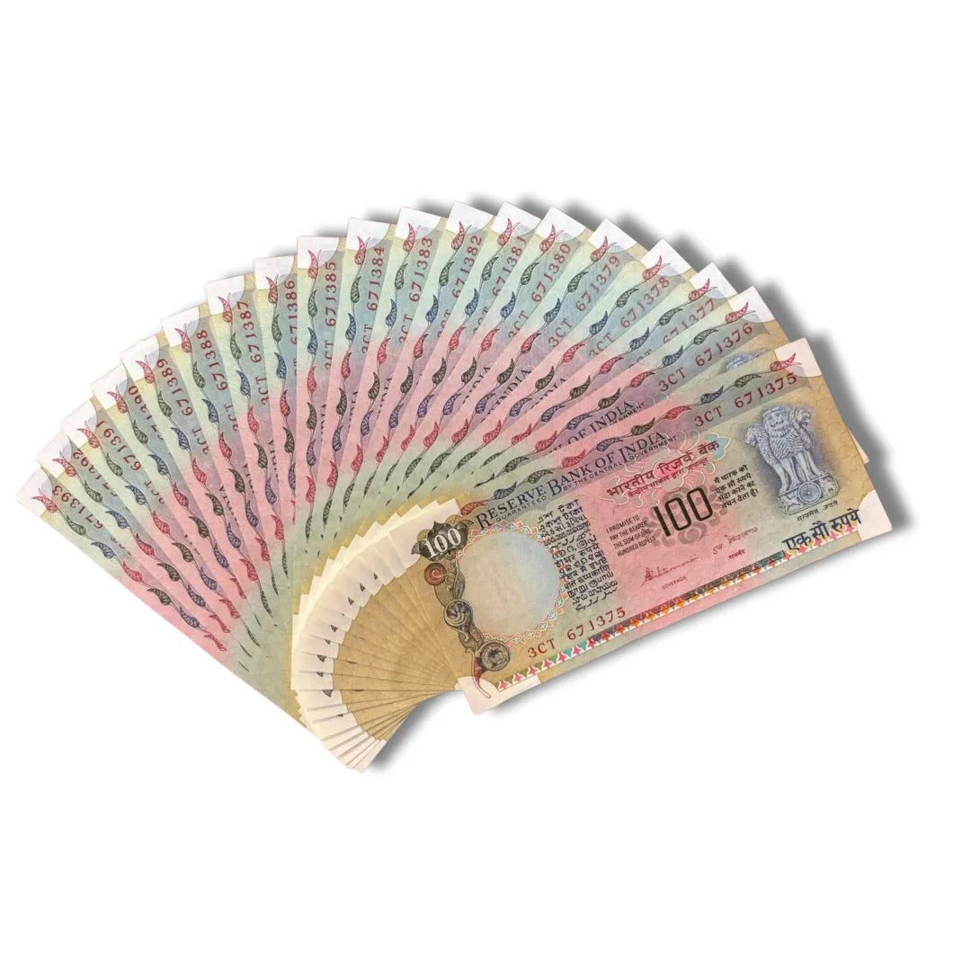 Fan arrangement of vintage Indian 100 rupee notes, collectible currency on white background
