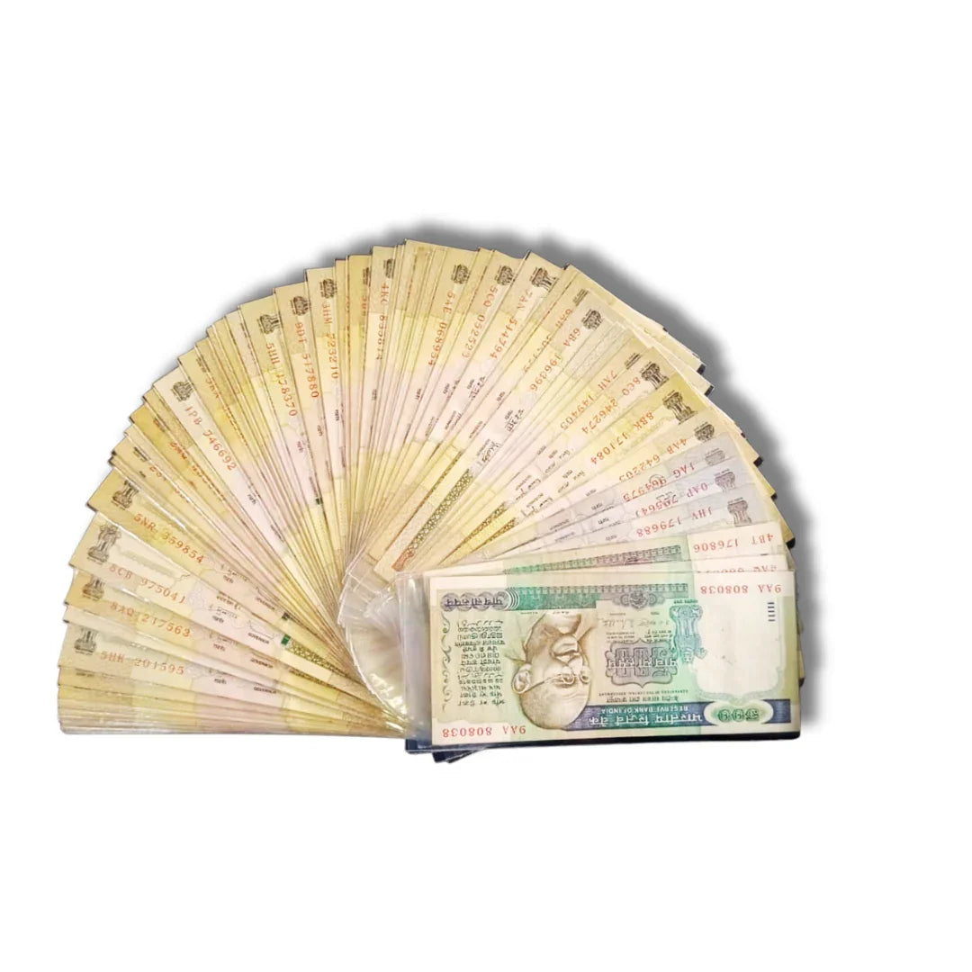 Fan display of collectible old Indian currency notes with visible serial numbers