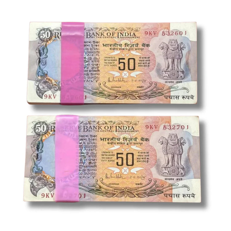 Two bundles of vintage Indian 50 rupees currency notes with pink bands, collectible notes