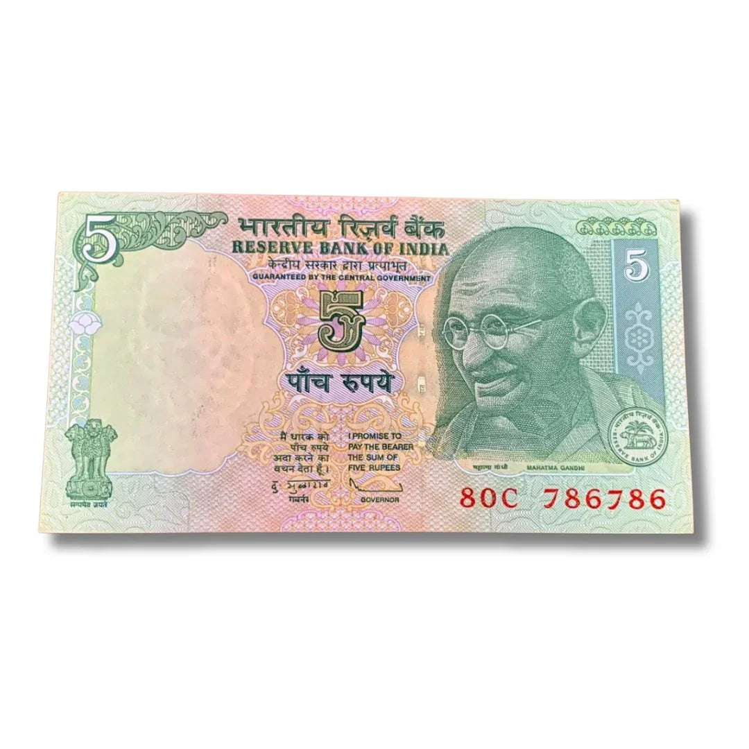 Indian 5 rupee currency note with serial number 786786 and Mahatma Gandhi portrait