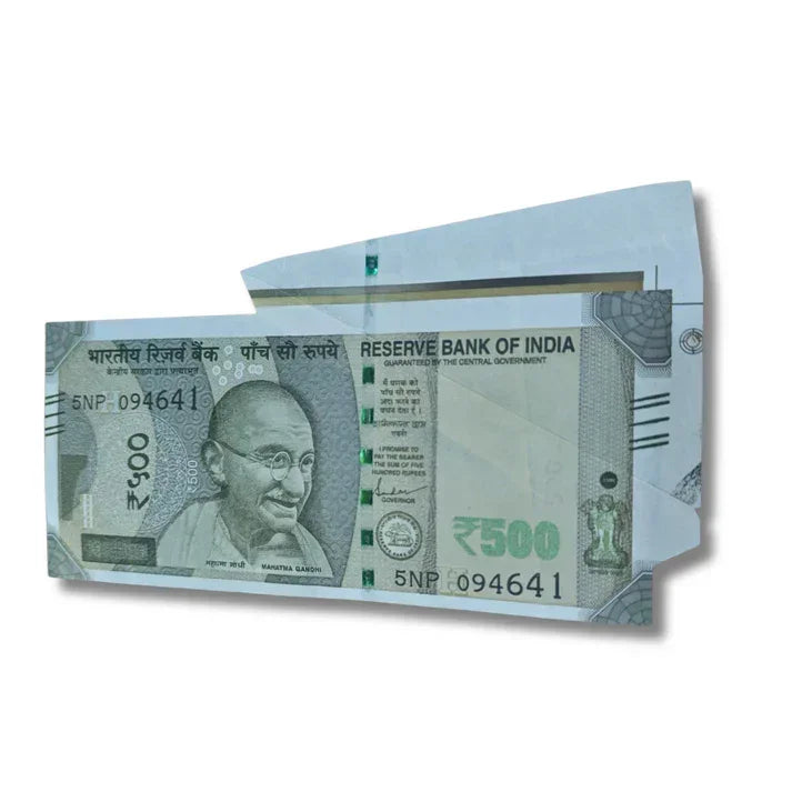 Indian 500 rupee collectible currency note in an open envelope on white background