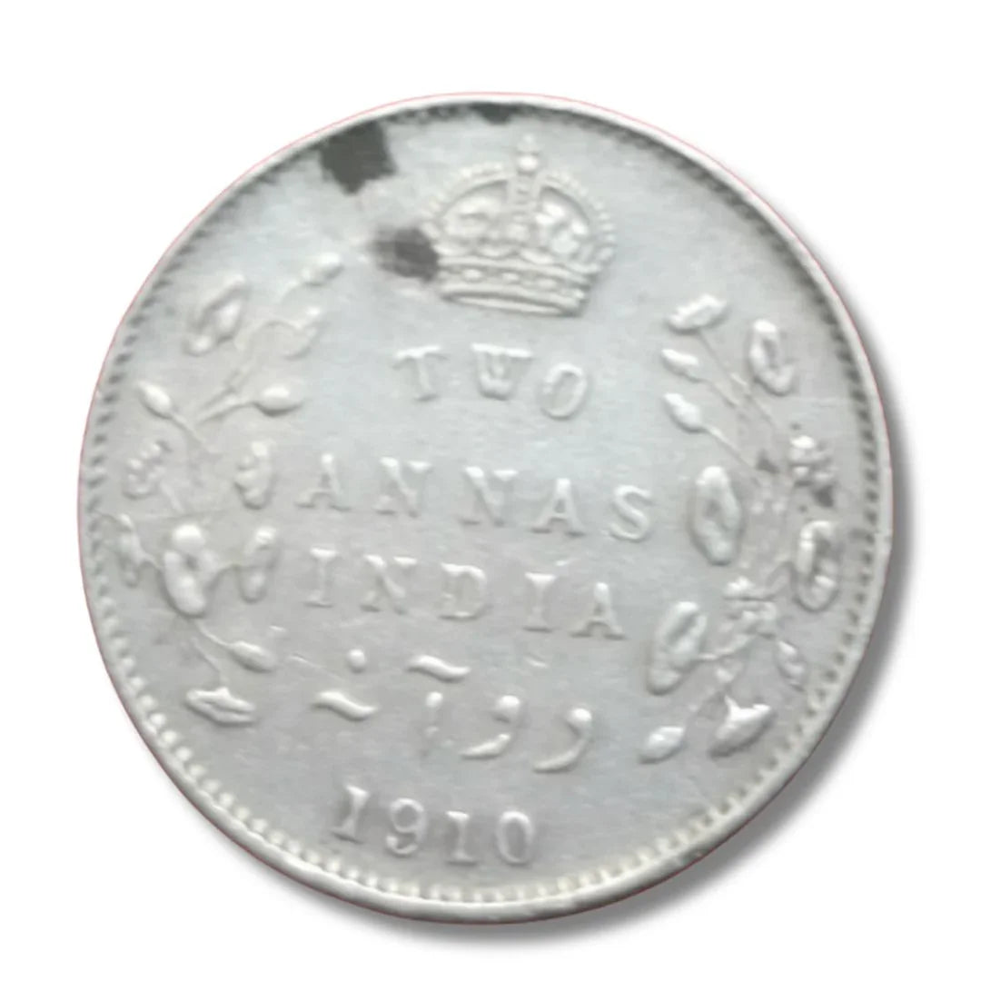 1910 British India two annas silver coin with crown and floral design, collectible currency