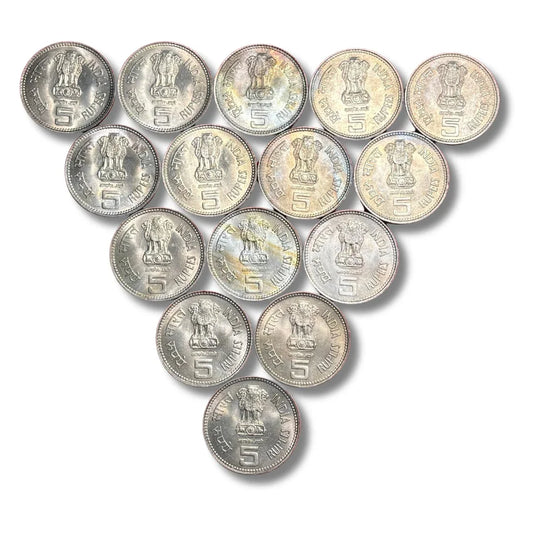 Collection of Indian 5 rupees coins arranged in a triangle on a white background