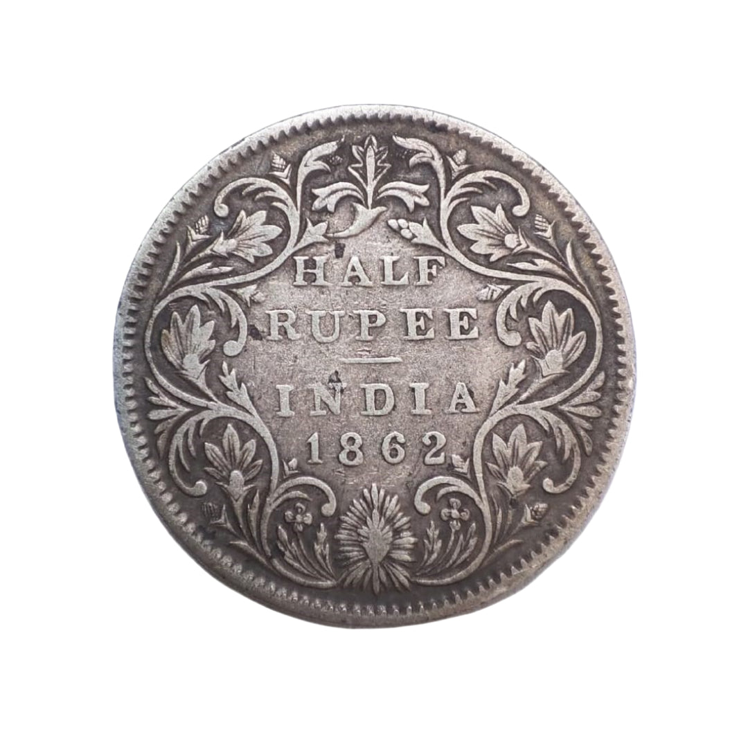 1862 India half rupee silver coin featuring Queen Victoria with floral wreath reverse, collectible British India coin.