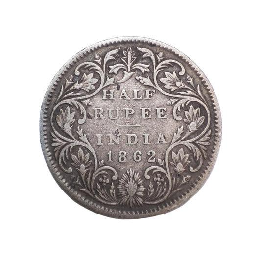 1862 India half rupee silver coin featuring Queen Victoria with floral wreath reverse, collectible British India coin.