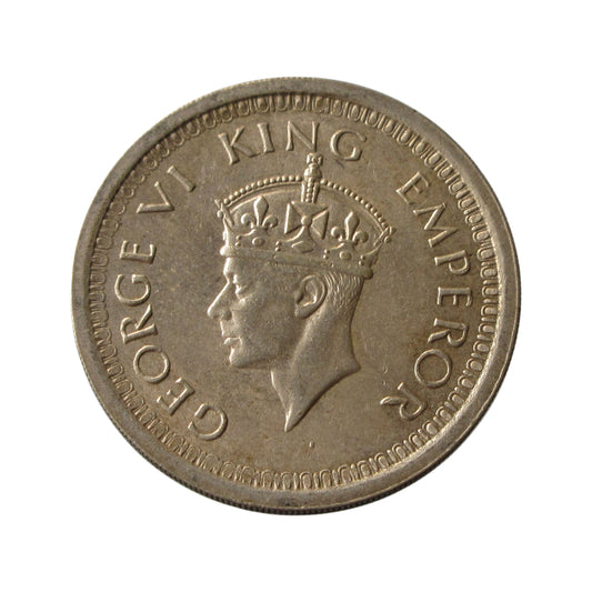 1944 One Rupee British India silver coin featuring George VI portrait and floral wreath reverse design.