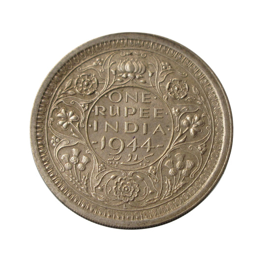 1944 One Rupee British India silver coin featuring George VI portrait and floral wreath reverse design.