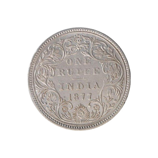 Rare 1877 India one rupee silver coin featuring Queen Victoria Empress with floral wreath reverse design, first empress issue British India coin.