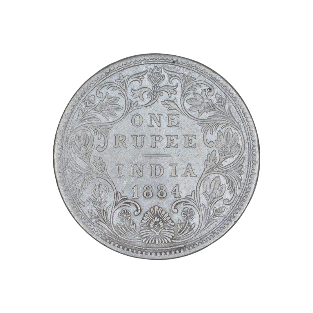 Rare 1884 India one rupee silver coin featuring Queen Victoria Empress with floral wreath reverse design, collectible British India coin.