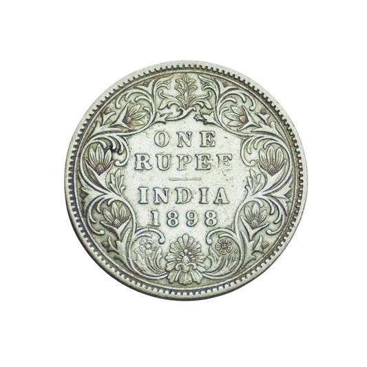 Rare 1898 India one rupee silver coin featuring Queen Victoria Empress with floral wreath reverse design, collectible British India coin.