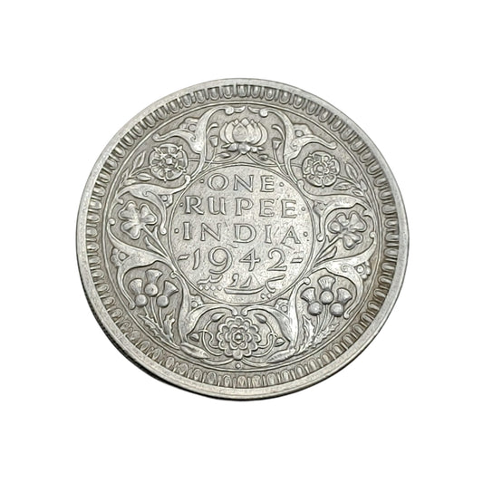 1942 India one rupee silver coin featuring King George VI with floral wreath reverse design, rare British India collectible.