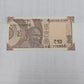 Rs 10 note with serial 778866 featuring holy 786 number, Gandhi portrait, and Konark Sun Temple design 