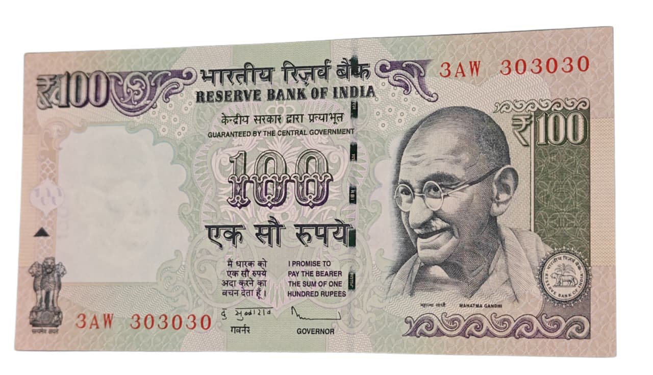 Rare Rs 100 old agriculture note with tripling fancy number 303030 in UNC condition.