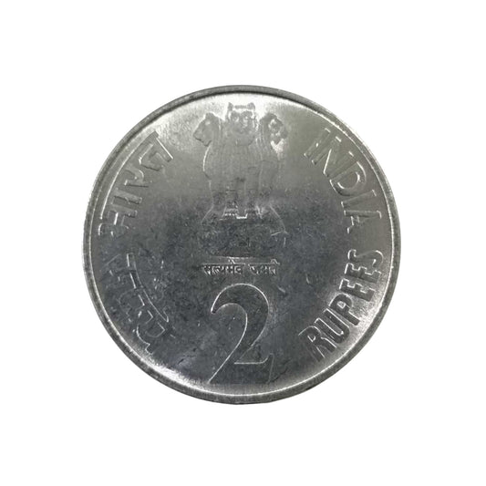2010 Rs 2 commemorative coin featuring RBI 75 years design with tiger and Reserve Bank of India logo.