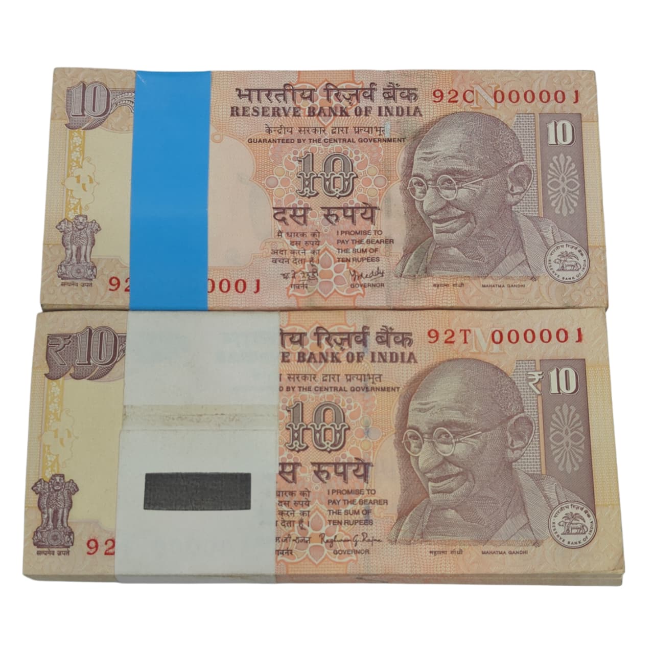 Rare Rs 10 note bundles with prefixes 92C and 92T, both serial number 000001, signed by RBI Governors Y. V. Reddy and Raghuram G. Rajan, 2 full bundles.