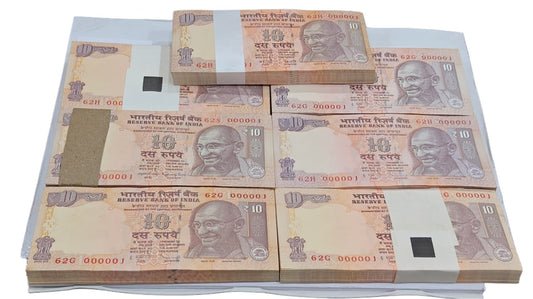 Rs 10 notes bundle set with 000001 serial number, 7 bundles of 100 UNC notes each, signed by RBI Governors Y. V. Reddy, D. Subbarao, and Raghuram G. Rajan.